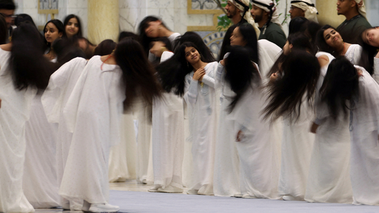 What is the hair flipping ritual performed by women to welcome Trump in UAE?