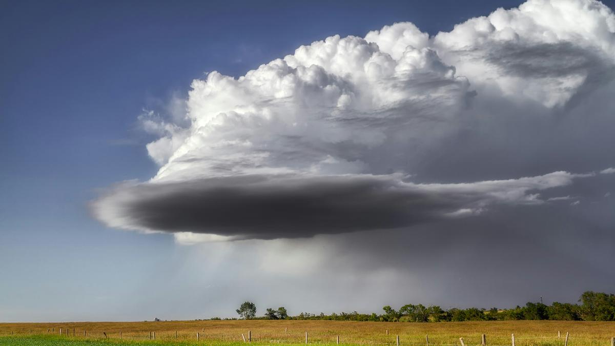 Why do cloudbursts cause such sudden and intense rain?